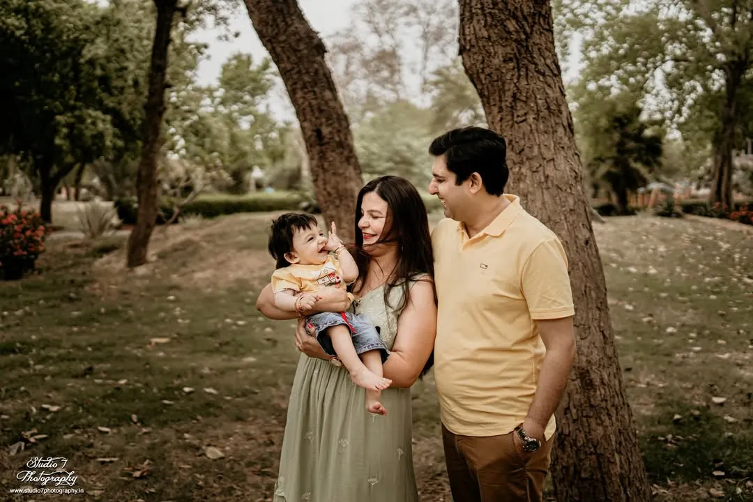 I love capturing the unposed, happy moments during an outdoor family session. The genuine laughter and connection between this family in a beautiful park setting is what makes a portrait timeless.