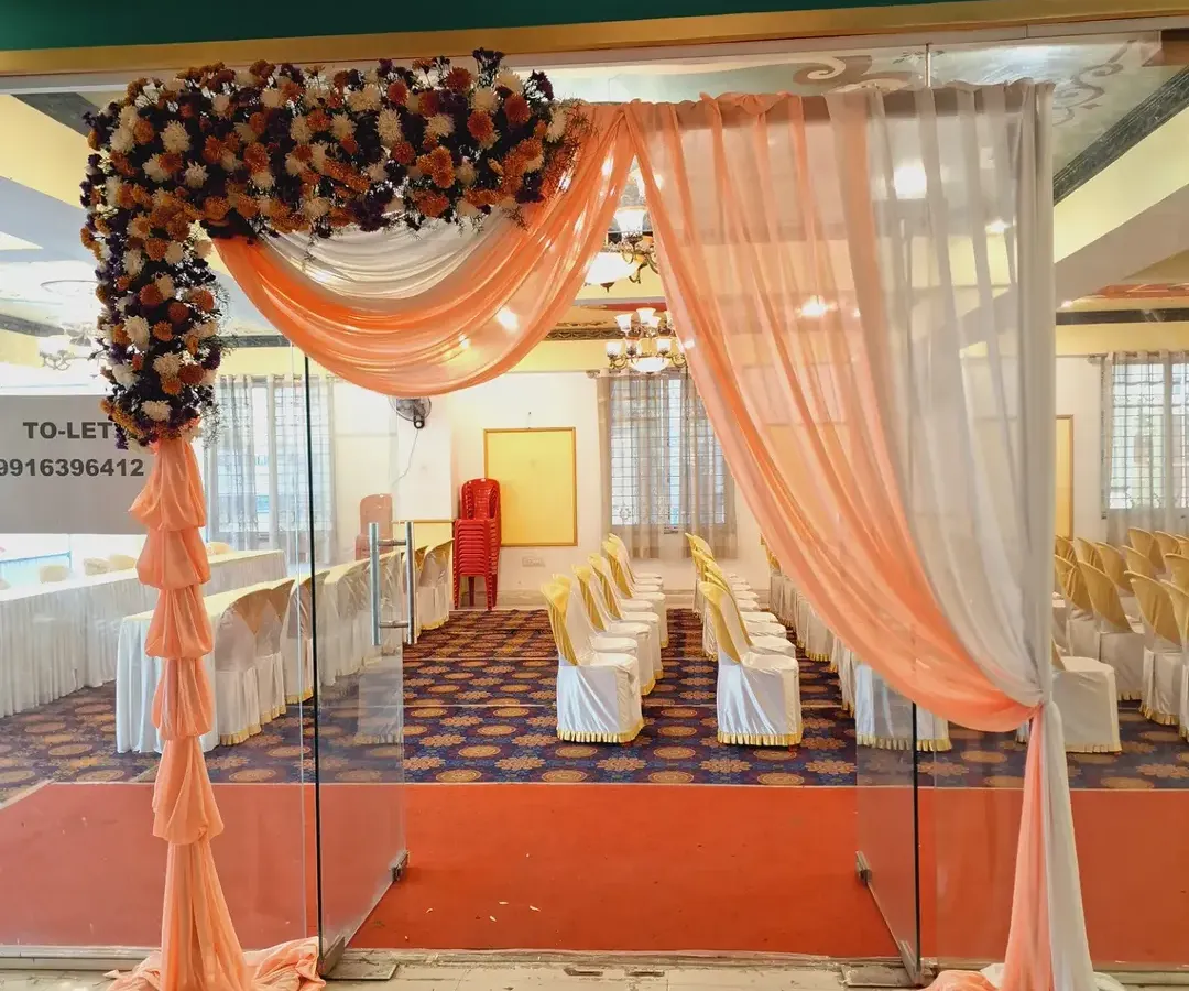 I design elegant entrances with custom floral arrangements and fabric draping that can be matched to your company's brand colors, setting a professional and welcoming tone for any corporate function.