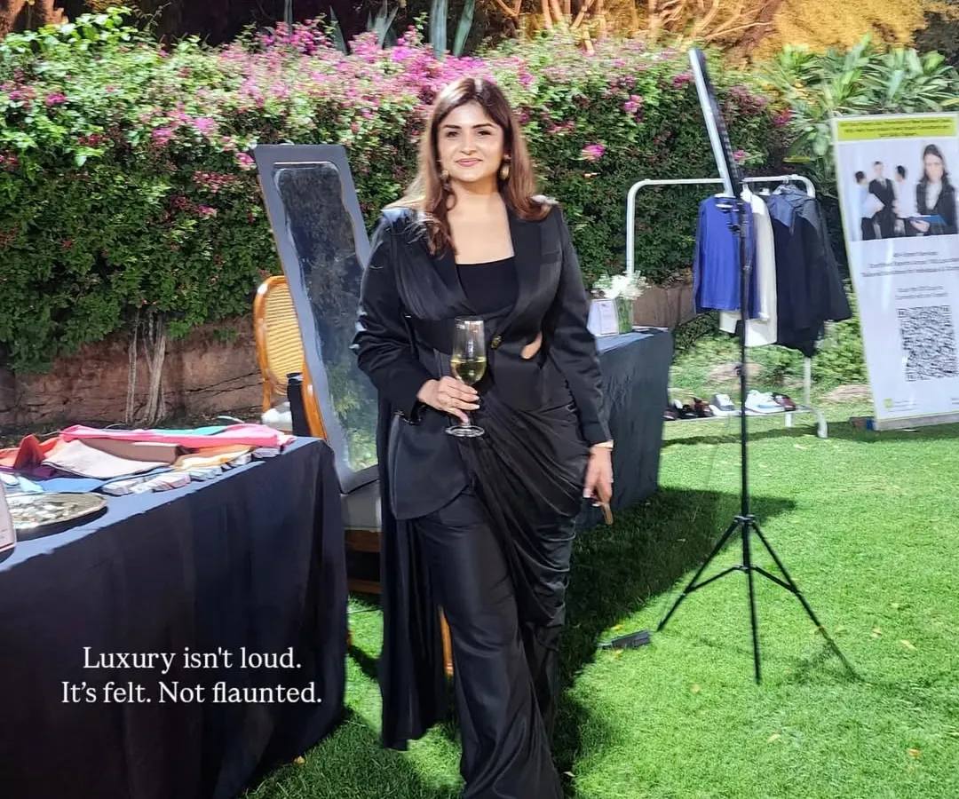 I believe luxury is a feeling, not a label. It's about how you carry yourself and the quiet confidence your style projects. This look, featuring a black cutout power suit, embodies my philosophy of "aspirational distance" where elegance commands attention without demanding it.