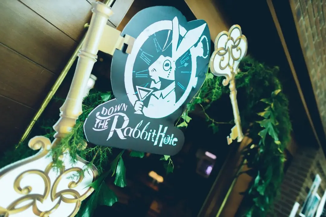 We love bringing a story to life. For this milestone celebration, we invited guests "Down the Rabbit Hole" with custom signage and props, setting the stage for a whimsical Alice in Wonderland themed brunch.