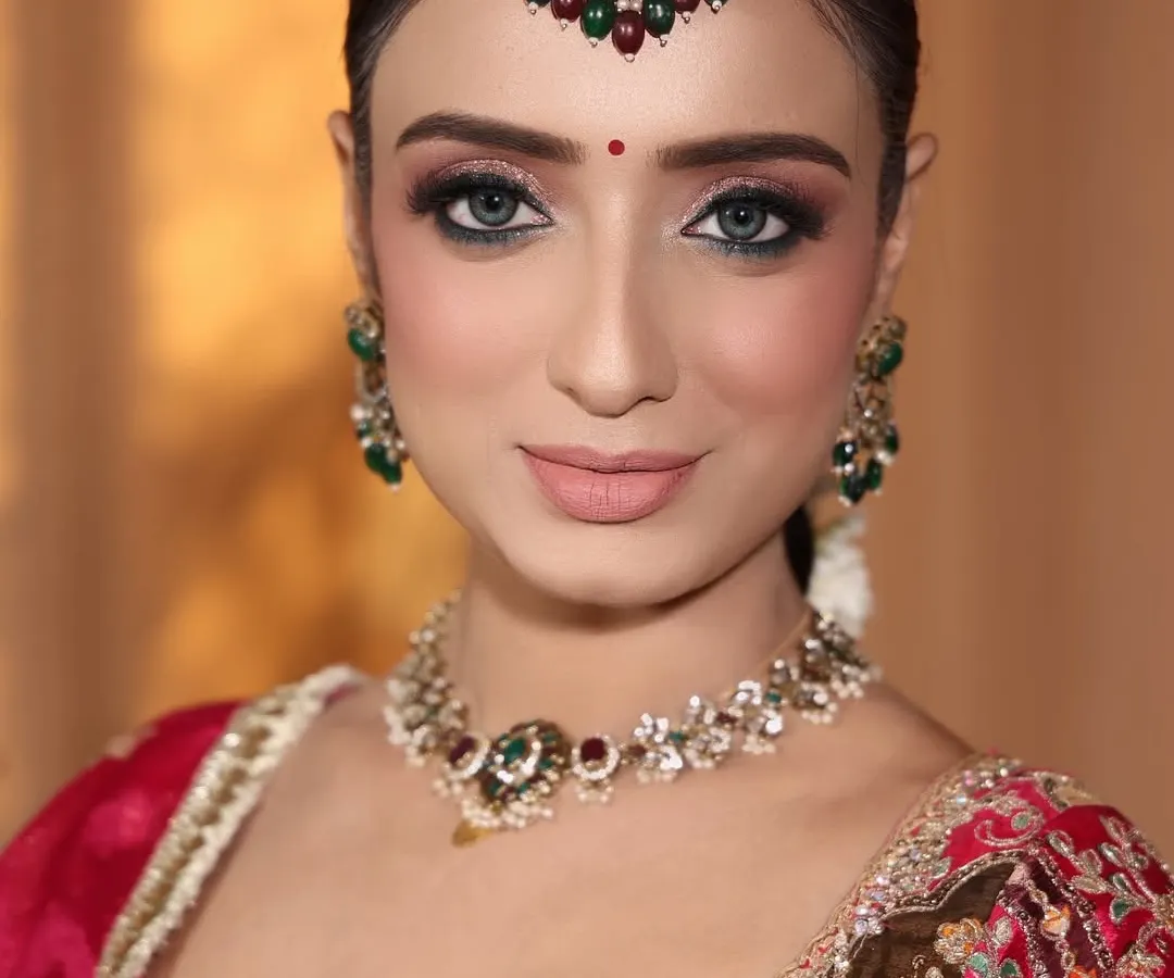A close-up of my beautiful bride. Her stunning eyes are enhanced with sharp winged eyeliner and soft eyeshadow, perfect for her traditional wedding look.