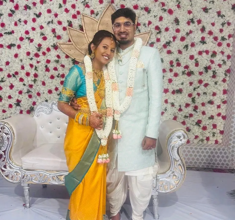 Here is our lovely client Geeta with her husband, creating a beautiful memory on their special day. She is draped in a vibrant yellow Kanchipuram silk saree, a perfect choice for a wedding ceremony that radiates happiness and tradition.