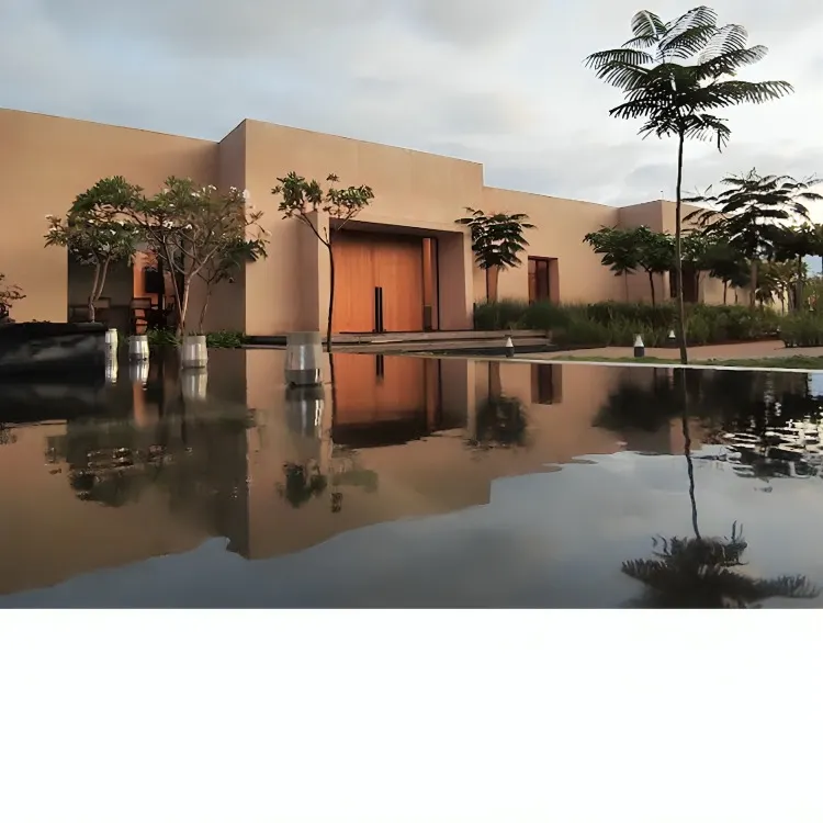 This is Earthsong, an experience center we designed to feel like it grew right out of the land. The minimalist, earth-toned structure is reflected in the water, creating a moment of pause and connection with the environment before you even step inside.