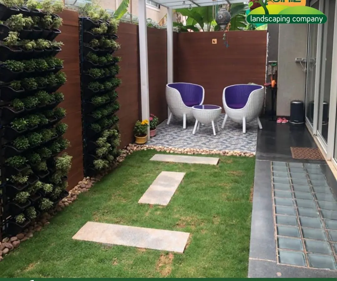 This project showcases a complete courtyard makeover. We integrated vertical gardens with a manicured lawn, stone pathways, and a covered seating area to create a private, functional, and serene urban oasis for our client.