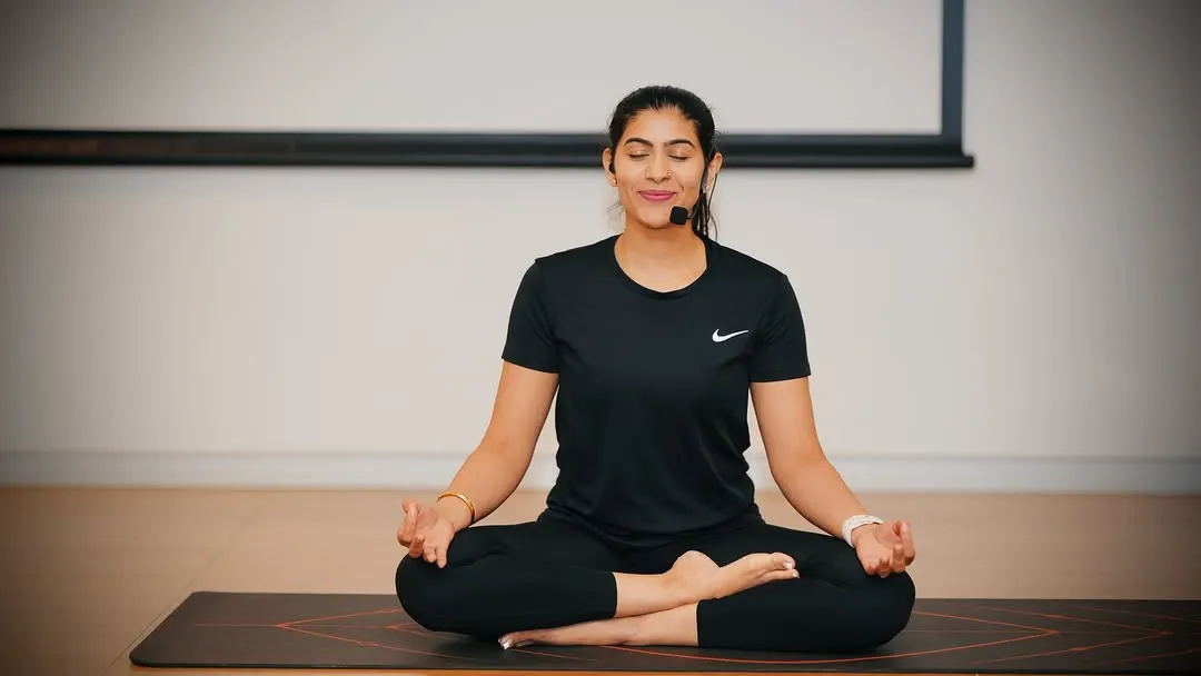 Finding calm in the chaos is essential for corporate life. I guide teams through mindfulness and meditation practices, like this seated session, to help reduce stress and improve mental clarity right at their desks.