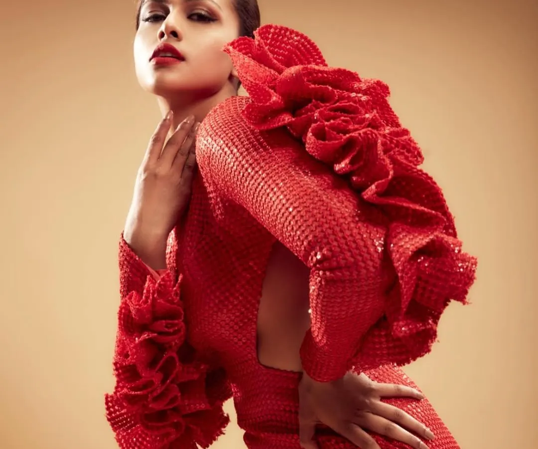 For this high-fashion editorial shoot, I created a bold and glamorous look featuring a classic red lip and sculpted features. The makeup is designed to be dramatic and confident, complementing the structured, avant-garde red gown.