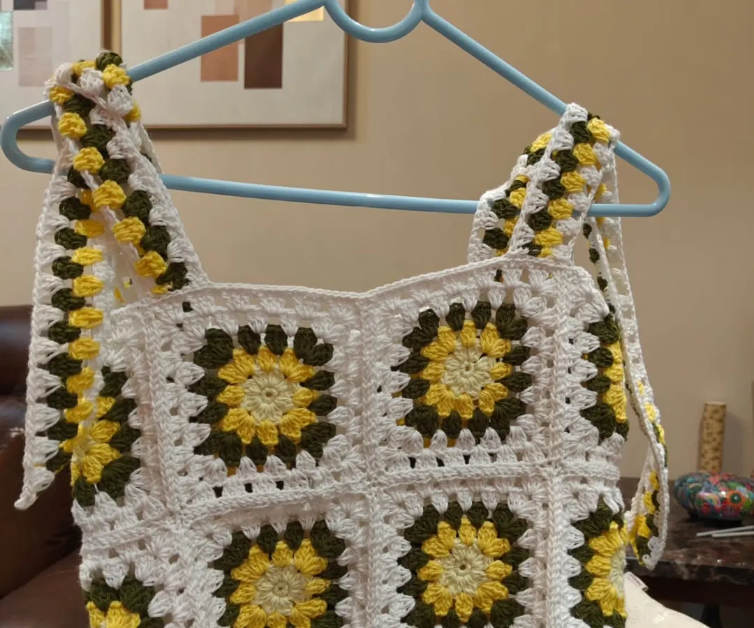 Capturing the joy of summer in a top. This sunflower-themed granny square crop top is a favorite for its cheerful vibe and easy-to-wear style. I designed it with adjustable straps for a perfect, comfortable fit, making it a go-to piece for sunny days.