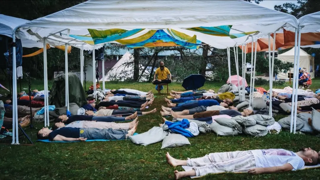 Here you see a Group Sound Bath, where participants lie down and let the healing sounds of singing bowls and gongs wash over them. In these sessions, we create a shared space of tranquility, allowing the collective energy to deepen the meditative and healing experience for everyone involved.