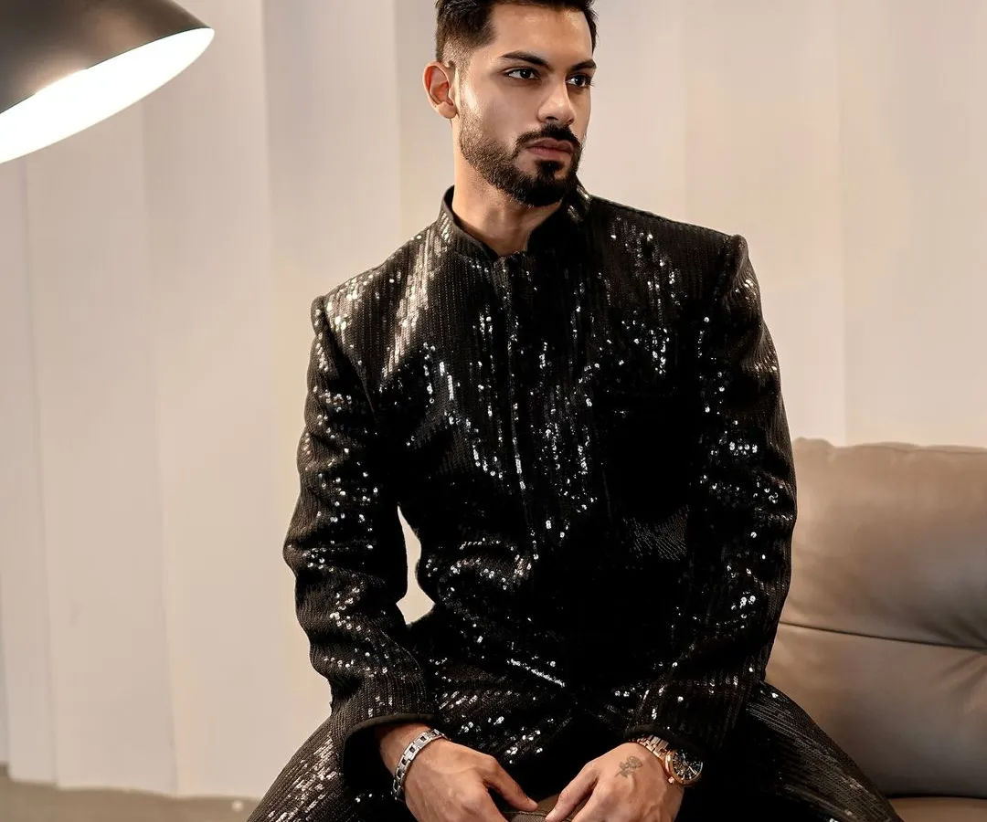 For your cocktail nights and sangeets, we created this fully sequined black Indo-Western jacket. The sharp tailoring and shimmering texture make it a definitive statement piece, designed to catch the light and command attention.