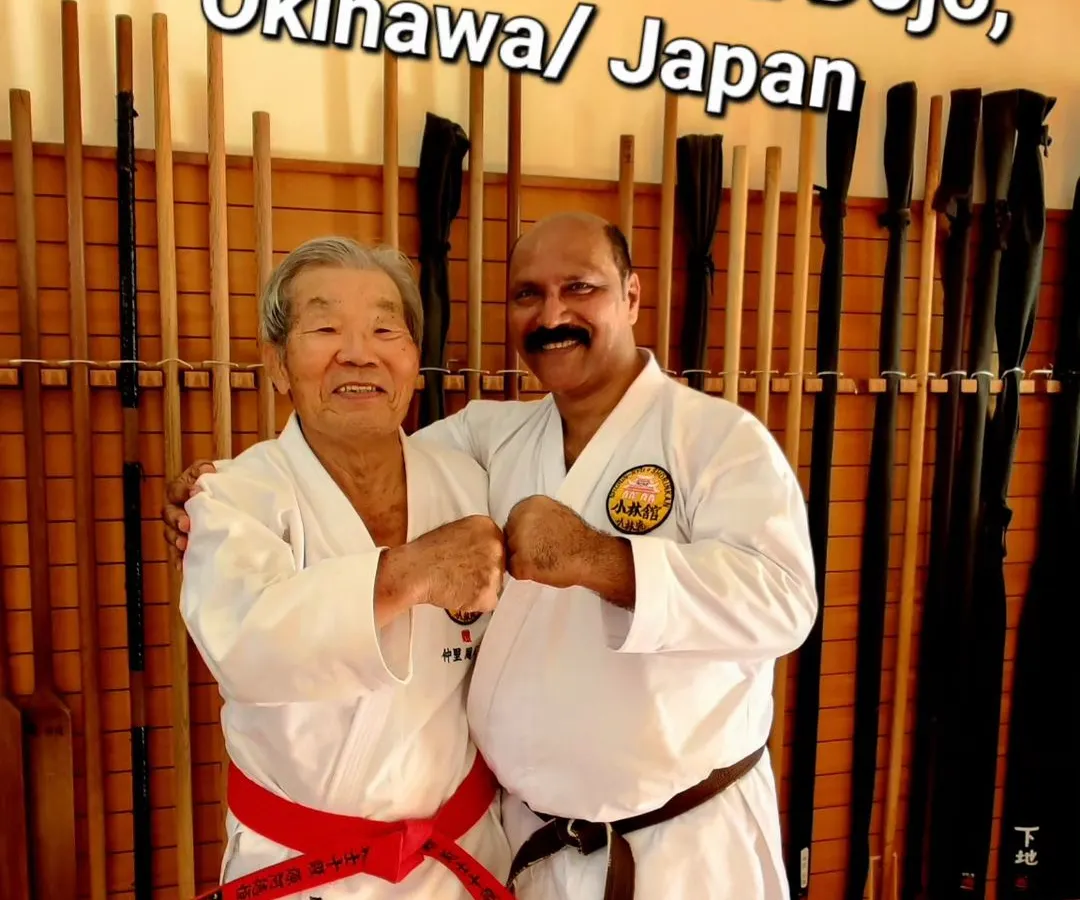 With my teacher at the Shorinkan Honbu Dojo in Okinawa, Japan. This connection is the heart of my teaching. I ensure that the karate you learn here is the same pure, traditional martial art practiced at its source.