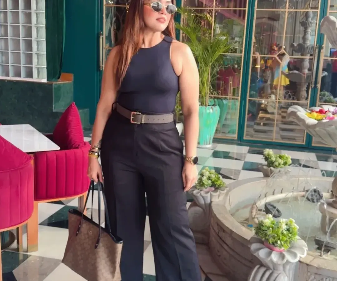 This is what I call power dressing. A sharp, all-black ensemble with a defined silhouette that's perfect for making a strong impression. This look combines a classic Zara top with Michael Kors and Coach accessories for effortless authority.