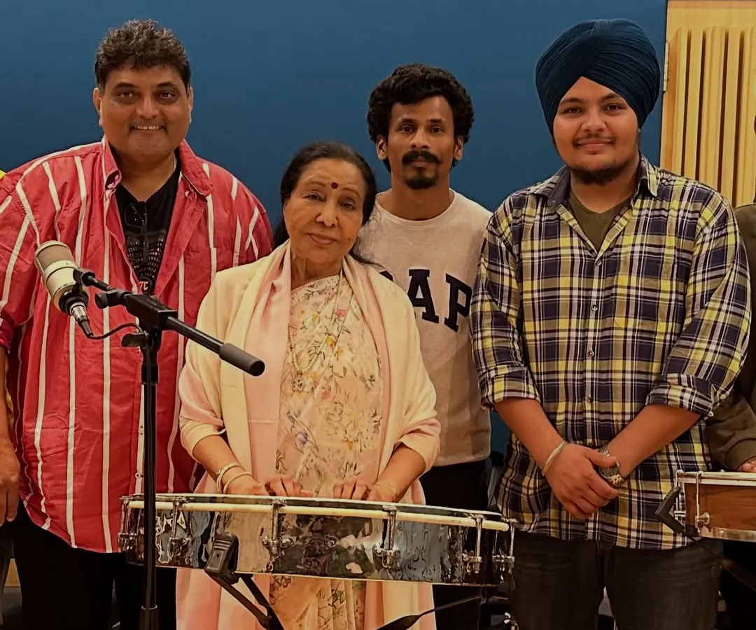 A truly blessed moment with the queen of melody, Asha Bhosle ji. Being in her presence is a lesson in itself, and I am grateful for the opportunity to witness her artistry up close during a recording session.