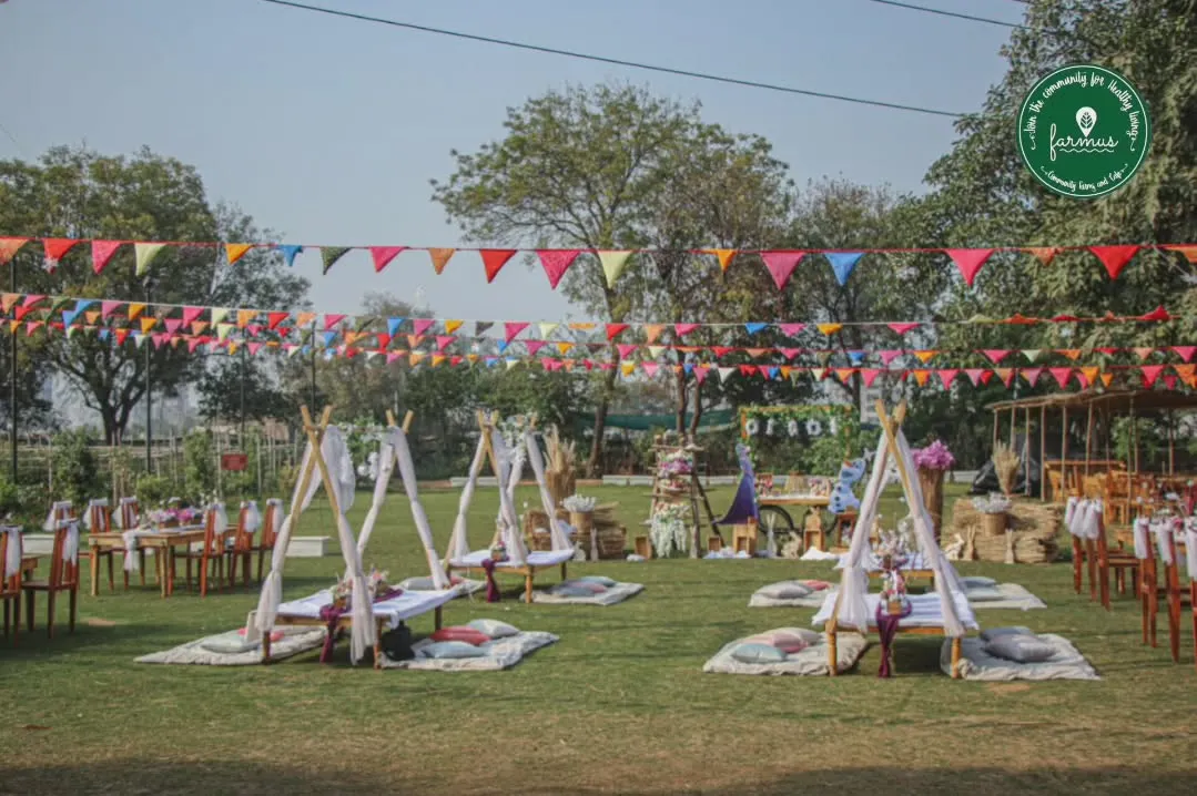 Imagine your next celebration set up like this. We create beautiful, relaxed picnic and party settings with charming teepees and colorful bunting, perfect for making memories in the open air.