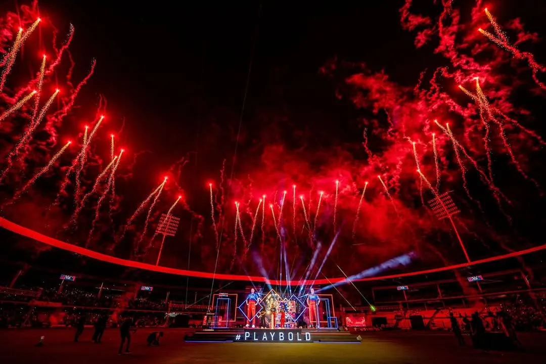 For RCB Unbox, we filled the stadium with the team's fiery spirit. This shot captures the peak of the event, with a custom stage design and a massive red firework display that created an electrifying atmosphere for tens of thousands of fans.