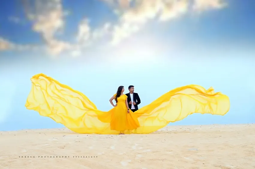 Our flying gowns are perfect for creating breathtaking photos. This vibrant yellow gown looks spectacular against the open sky and beach, and the long, flowing fabric creates a magical effect in your pre-wedding or maternity pictures.