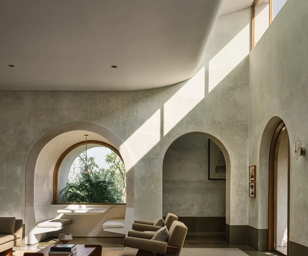 Inside the Dua Villa, we used light as a primary building material. Clerestory windows and curved ceilings sculpt the interior, casting dynamic shafts of sunlight that transform the living space throughout the day, creating a home that feels alive and connected to the outdoors.