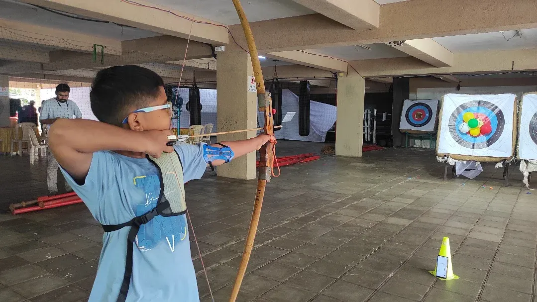 Focus is key in archery. Here, one of my young students demonstrates excellent concentration and form while practicing with an Indian Round Bow. I guide each archer to develop their technique and mental sharpness.