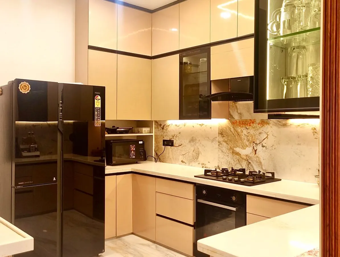 A kitchen should be as beautiful as it is functional. For this open-plan kitchen renovation, I used sleek, high-gloss cabinetry, integrated appliances, and dramatic under-cabinet lighting to highlight the beautiful marble backsplash, creating a space that’s perfect for both cooking and socializing.