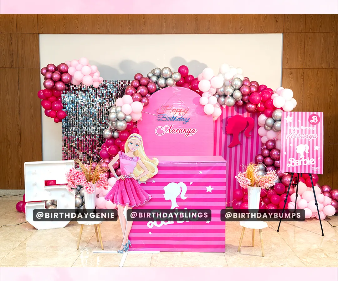 Step into a world of glamour with our stunning Barbie-themed birthday decoration. This setup includes a vibrant pink backdrop, a life-sized Barbie cutout, a dazzling silver shimmer wall, and a custom balloon arch in shades of pink and silver for the perfect photo opportunity.