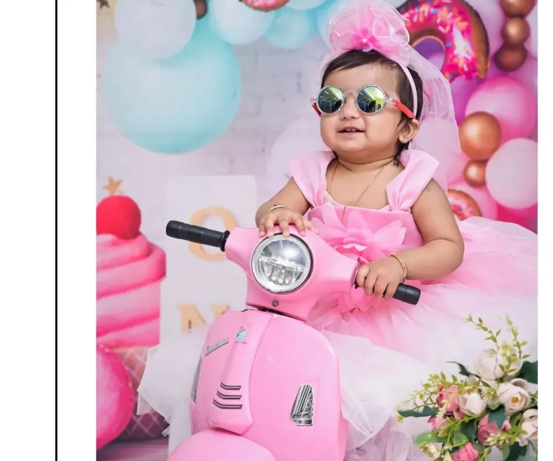 For this Candy Land themed shoot, we brought in a stylish pink scooter. I love incorporating fun props like this to bring a theme to life and capture your baby's personality.