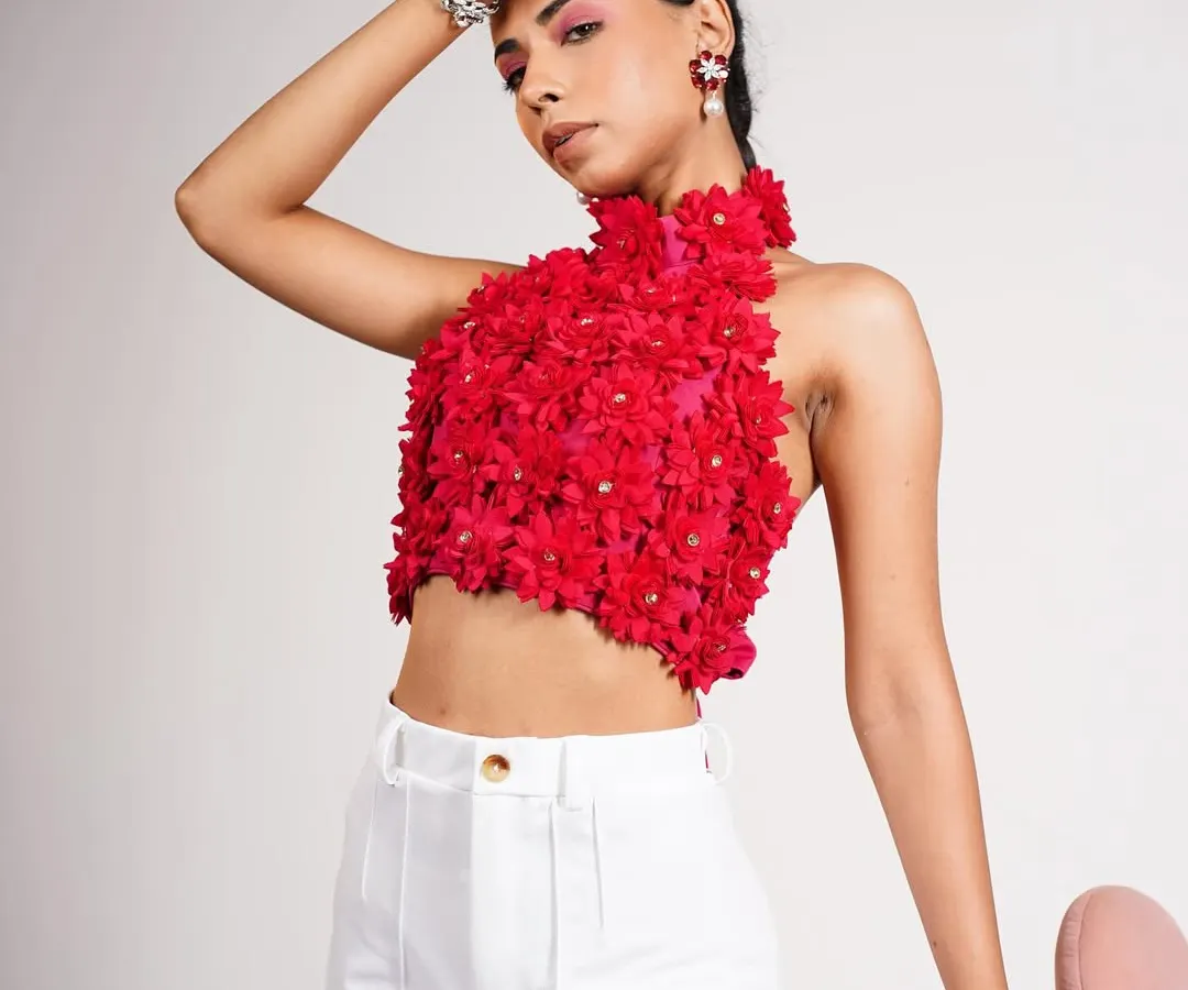 A bold, high-impact studio shot that showcases my ability to style with vibrant colors and intricate details. This look focuses on the handcrafted floral texture of the top, paired with clean white trousers for a balanced, modern aesthetic.