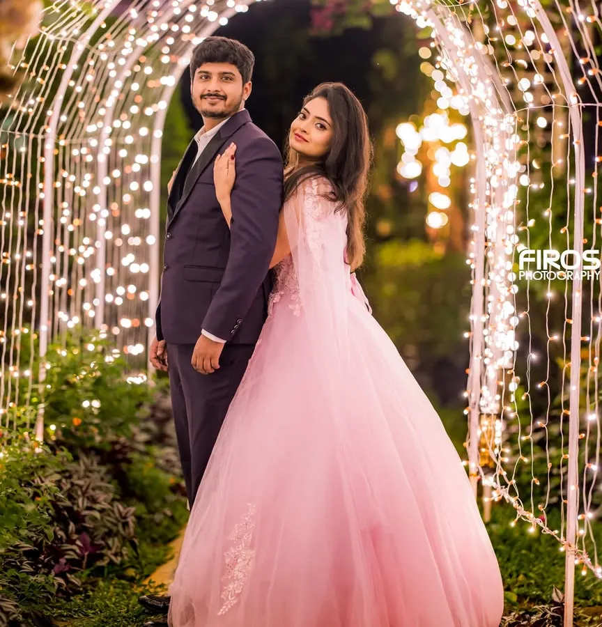 As evening falls, our garden transforms into a magical space. This tunnel of lights is a favorite for romantic couple portraits, creating a beautiful bokeh effect and an intimate atmosphere.