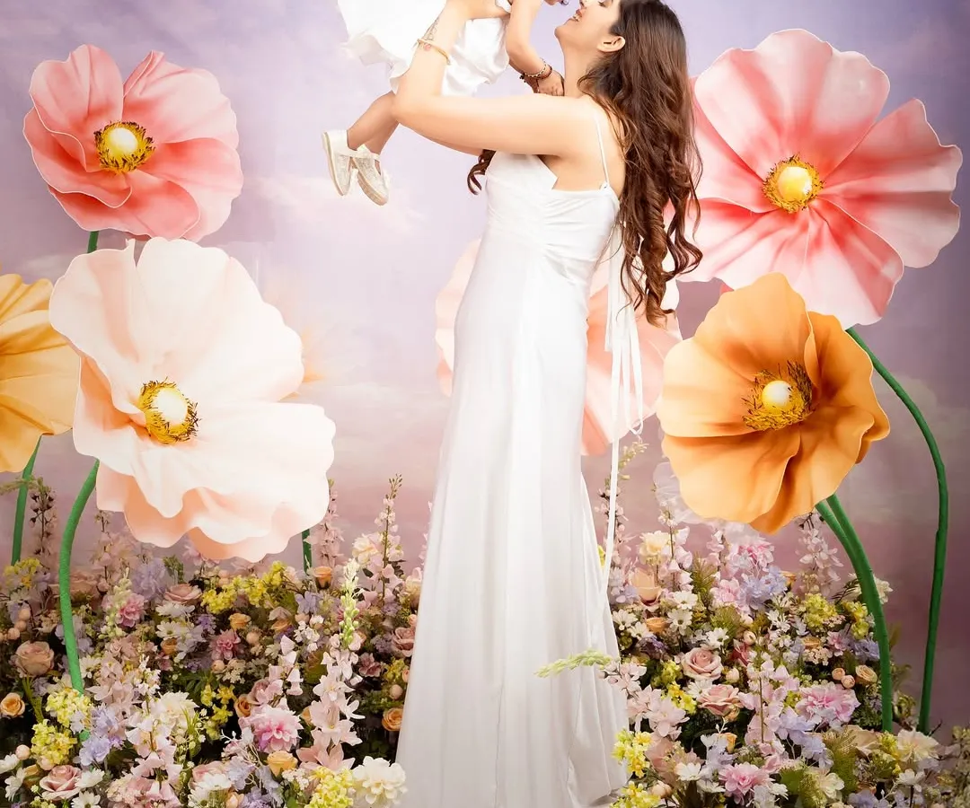 There is no bond like the one between a mother and her child. For this Mother's Day mini-session, I created a floral wonderland with giant paper flowers to capture this pure, uplifting love. These are the moments that fill your heart and your walls.