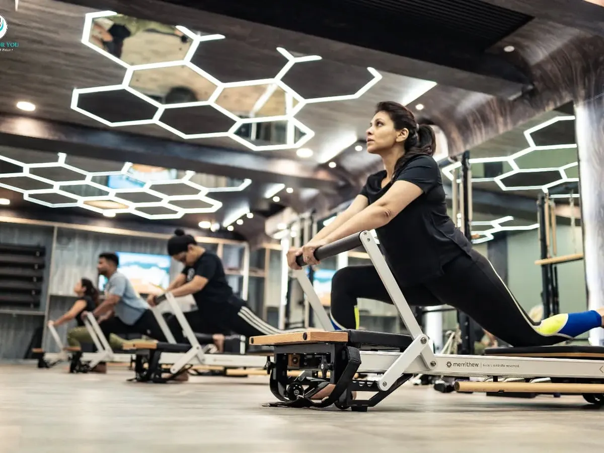 Here you can see the energy of a group reformer class. Each client is focused on their own lunge variation, building leg strength and stability in a supportive and motivating environment.