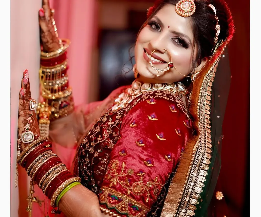 A classic bridal portrait showcasing the bride's joyful smile and intricate wedding attire. We focus on capturing the happiness and radiance of the bride on her wedding day with clean, vibrant photography.