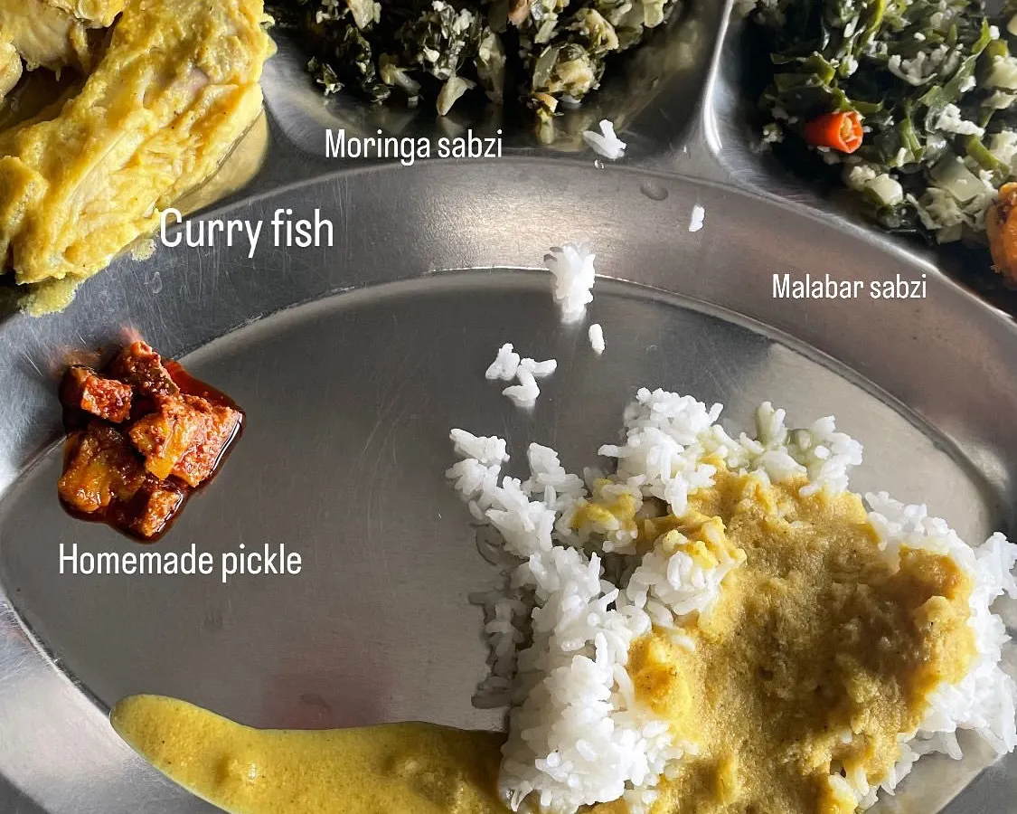 This is a real meal from one of my clients, designed specifically for their health goals. My approach is never one-size-fits-all. I create personalized, culturally aware, and science-informed nutrition plans that are practical for your real life, whether it's a fish curry meal or a simple dal and rice.