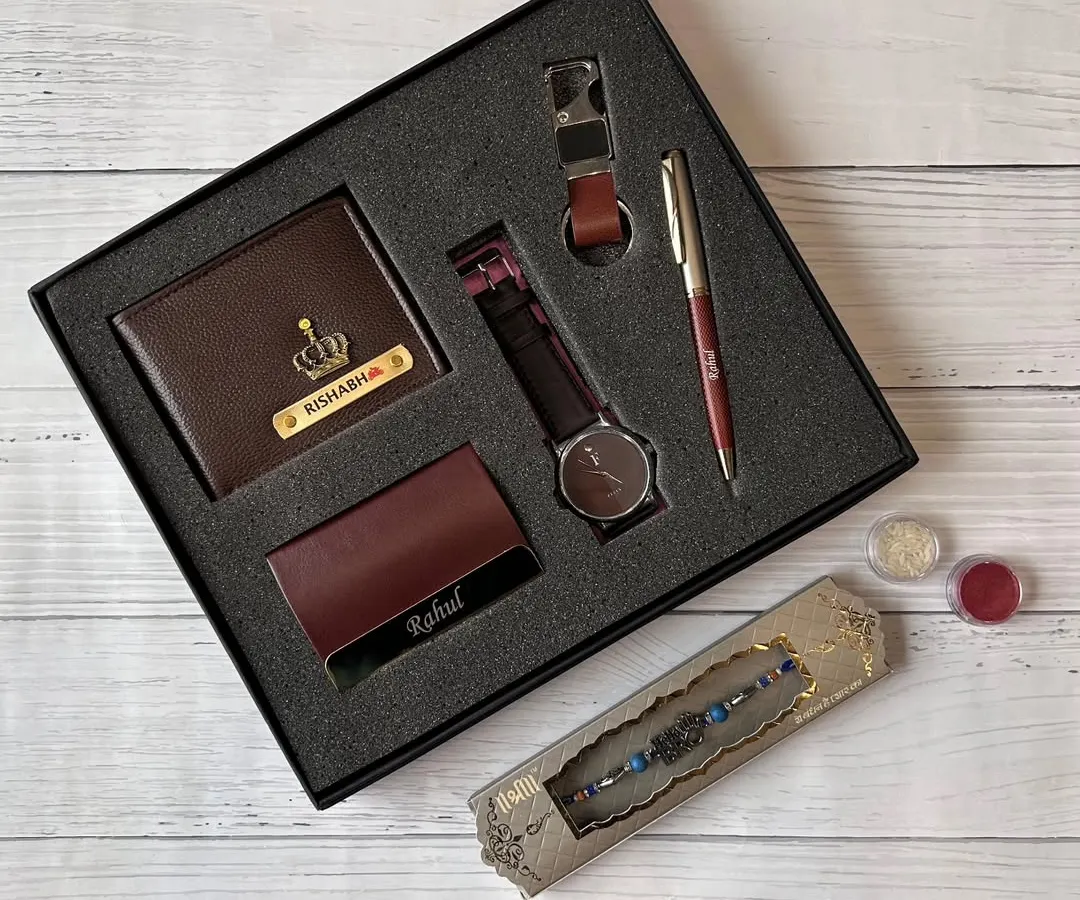 This is my go-to gift set for men. It features a personalized wallet and cardholder, a watch, a pen, and a rakhi, all neatly arranged in a premium gift box, making it a perfect and complete present for any occasion.