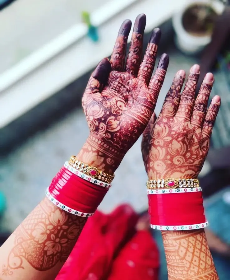 This is the beautiful, deep maroon stain my brides love. I achieve this color using my own 100% organic, chemical-free henna paste and will share all my aftercare secrets with you to make it last.
