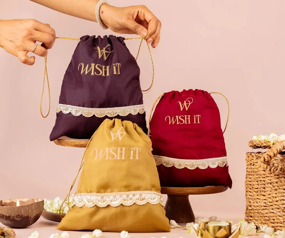 My modern take on the traditional thamboolam. These velvet potlis in rich jewel tones are a favorite for weddings, combining timeless elegance with a fresh, stylish feel that guests will love and reuse.