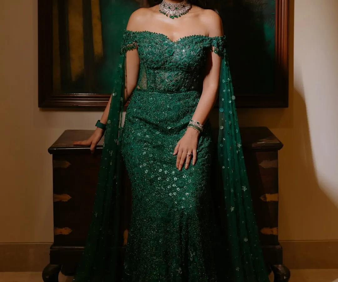 A full view of the reception look, where the makeup perfectly complements the stunning emerald gown. The goal was to create a cohesive, elegant style that is both glamorous for the evening and photographs beautifully from every angle. This is the essence of effortless, head-to-toe radiance.