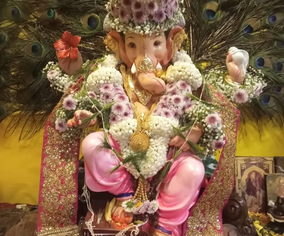 A close-up of our floral adornments for a beloved Ganpati Bappa. We design everything from the delicate garland to the intricate crown, using fresh flowers to bring divine beauty to your festival celebrations.
