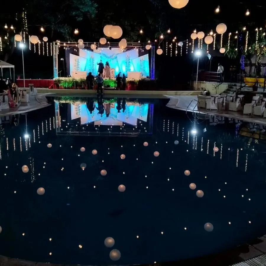 Imagine having your wedding reception here. This is one of my resort venues in Panvel with a stunning poolside stage setup, perfect for giving your event a destination wedding feel without leaving Navi Mumbai.