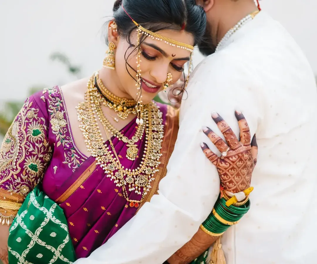A quiet moment of togetherness for the bride and groom. I focus on capturing the deep connection and emotion in traditional Maharashtrian wedding attire, creating a timeless portrait.