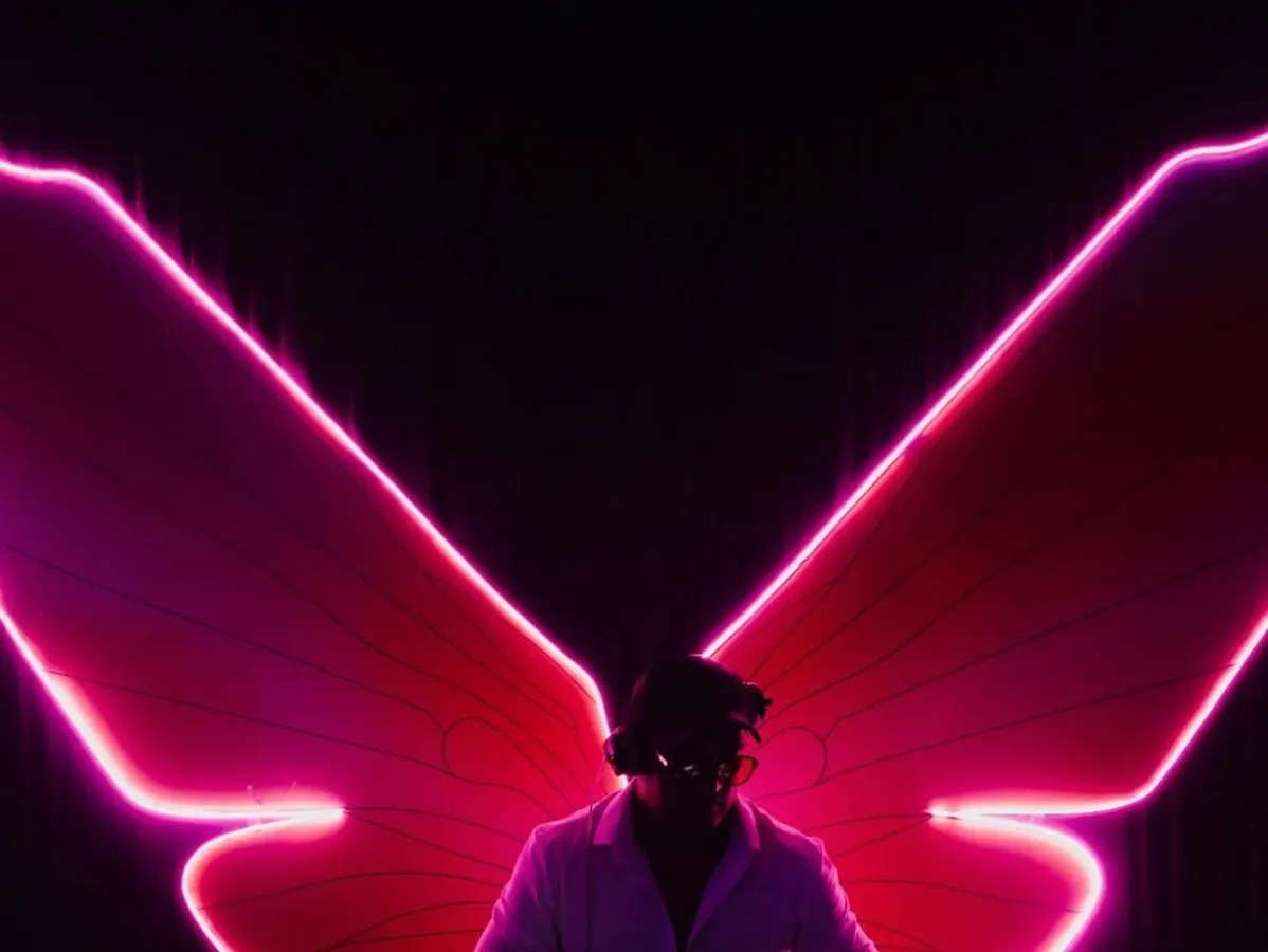 Spreading my musical wings. This shot captures the feeling of being in the zone, where the music takes over and creates a larger-than-life experience on the dance floor.