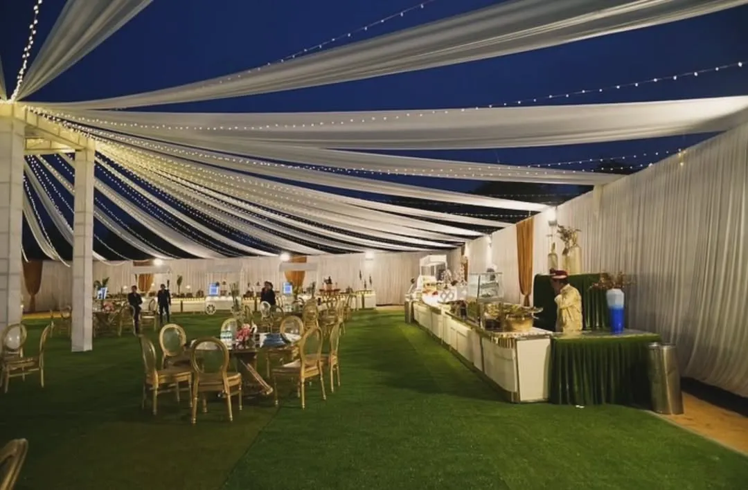 Picture this: an elegant outdoor reception under a canopy of flowing white drapes and twinkling fairy lights. I design the entire atmosphere to make your event feel magical, from the grand layout to the smallest detail.
