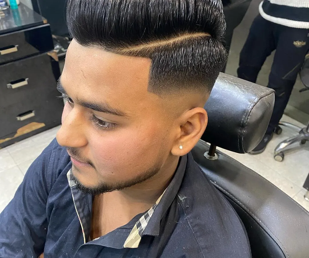 A perfect high-volume pompadour isn't just about height, it's about the flawless blend. Here, I executed a clean skin fade that transitions smoothly into a full, styled top.