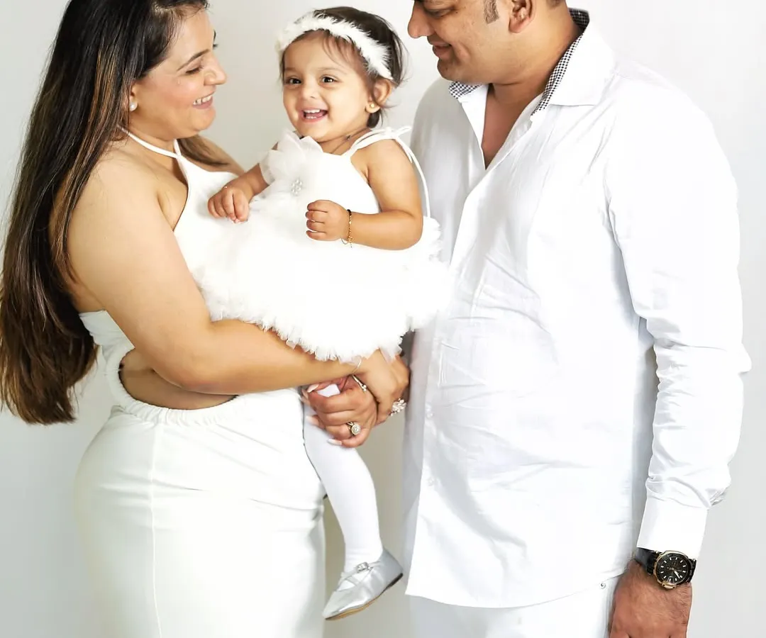 A classic family portrait session, timeless and full of love. Coordinating in white creates a clean, bright look that keeps the focus on the happy interactions and beautiful smiles.
