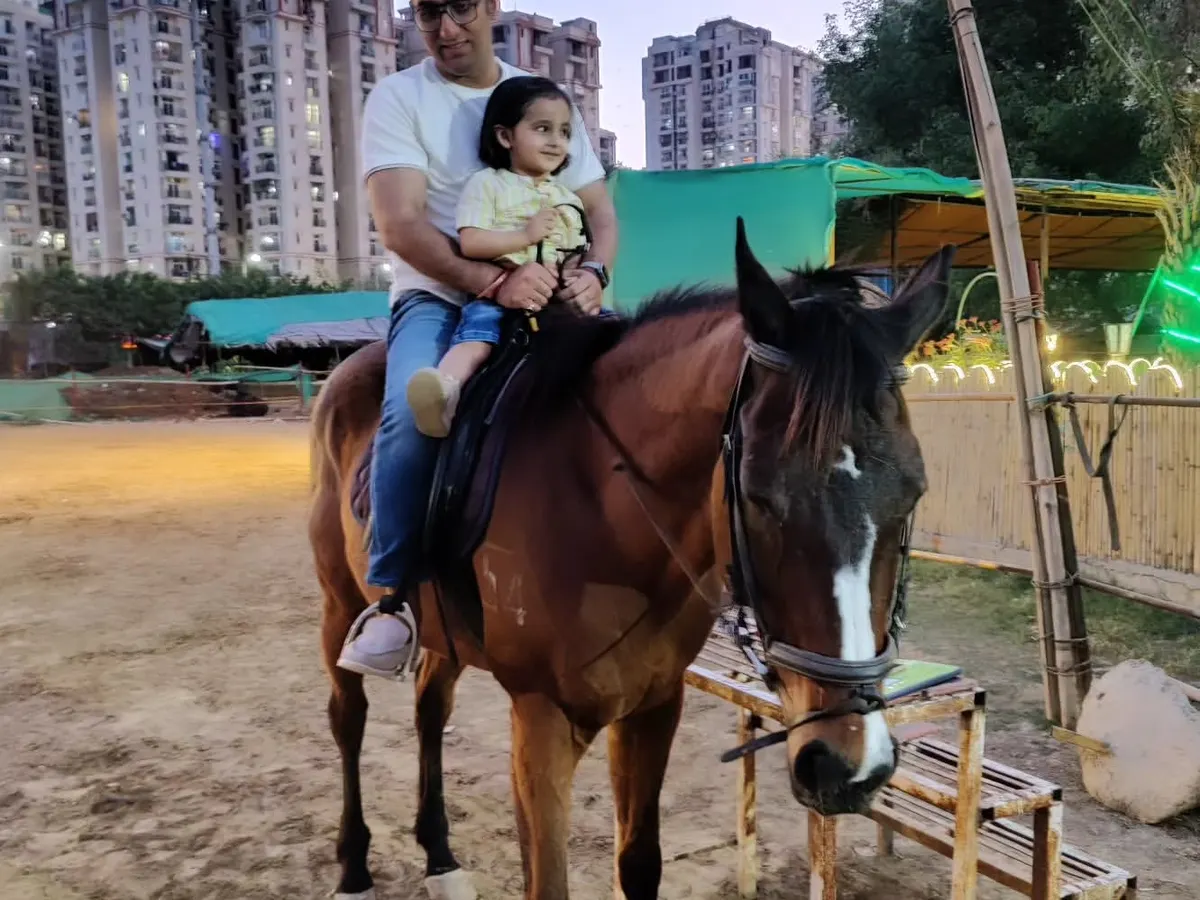 We love creating unforgettable family moments. Here, a father enjoys a safe and gentle ride with his young daughter, showing that horse riding can be a joy for all ages.