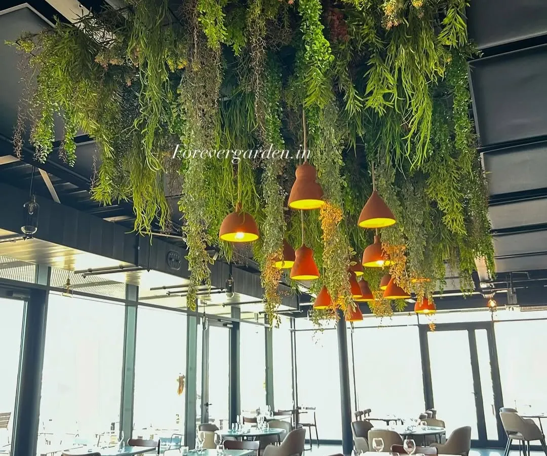 We created a lush overhead garden for this restaurant, using a variety of hanging ferns and foliage. This ceiling installation defines the dining space and creates an immersive, natural atmosphere without sacrificing floor space.