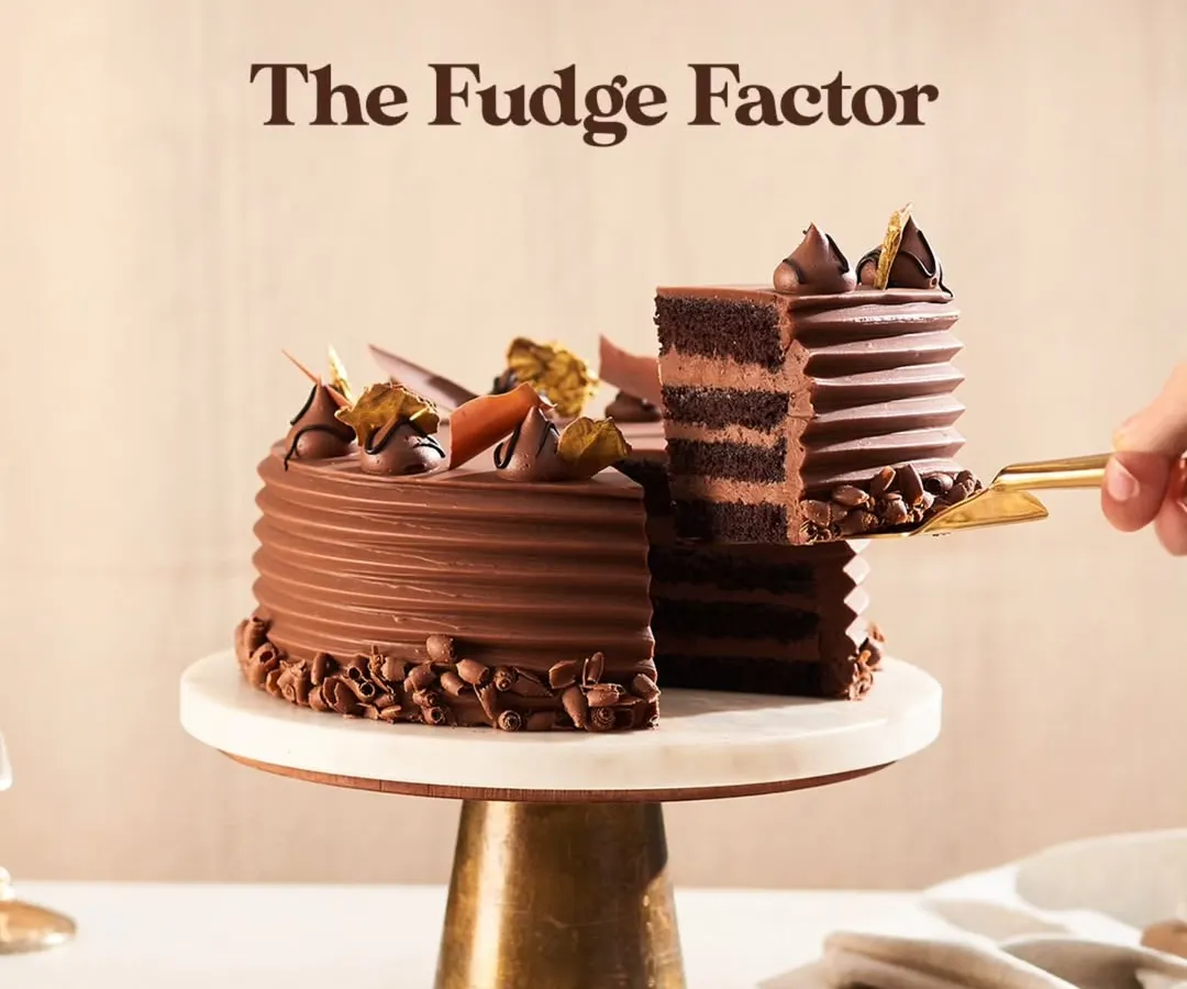 Here is my Chocolate Fudge Cake, a true showstopper for any celebration. I layer moist chocolate sponge with smooth buttercream and a rich milk chocolate ganache, then finish it with delicate chocolate flakes and gold leaf for that extra touch of elegance.