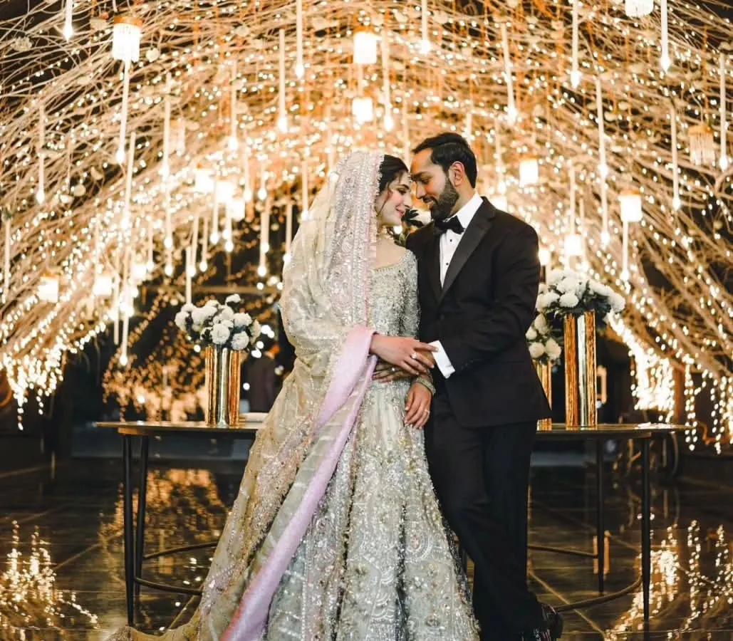 Under a canopy of twinkling fairy lights, I capture the quiet moments of connection. This reception shot shows the blend of luxury decor and genuine intimacy, creating a timeless portrait of the couple lost in their own world.