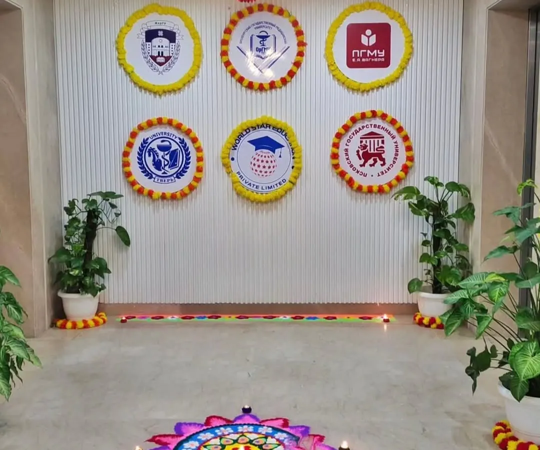 For Diwali, I create a festive and welcoming environment. Here you can see a beautiful rangoli at the entrance, complemented by custom company logos framed with marigold flowers to blend branding with tradition.