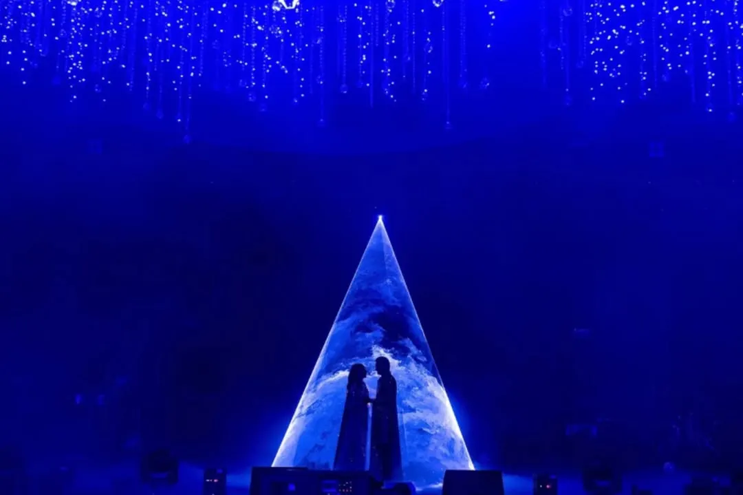 For a Sangeet night that was truly written in the stars, I created this dramatic silhouette moment. Using a cosmic projection against a deep blue backdrop, this design element transformed a performance into a celestial event, capturing the couple's love story in a single, powerful image.