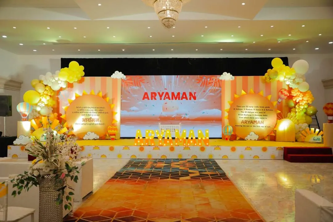 We love creating grand and immersive experiences. For this sunshine-themed naming ceremony, we designed a full stage setup with a vibrant LED screen backdrop, custom sun-shaped props, and cheerful balloon garlands to welcome baby Aryaman.