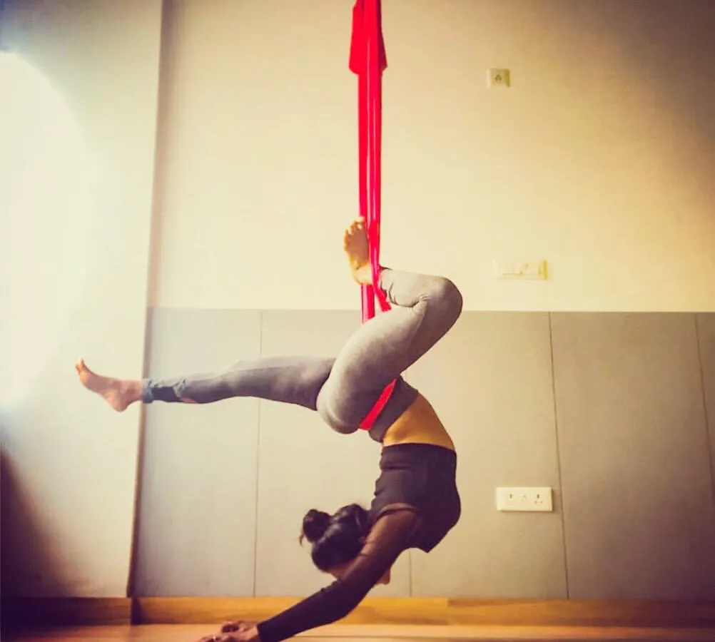 This is the kind of strength and grace you can build with consistent practice. The hammock acts as your partner, supporting you as you challenge your limits and discover what your body is truly capable of. This inverted pose is fantastic for building core and upper body strength.