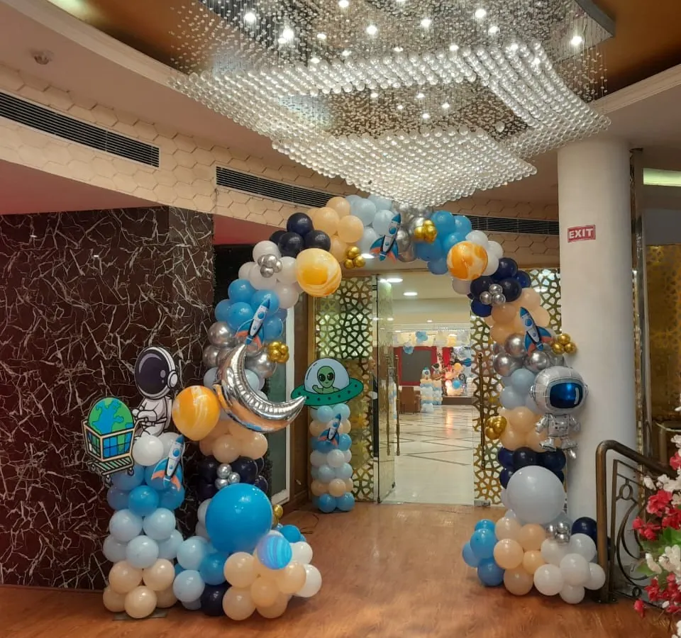 Blast off into an unforgettable celebration with our space-themed balloon arch. This grand entrance, complete with astronaut and rocket ship foil balloons, sets the stage for an out-of-this-world party adventure.